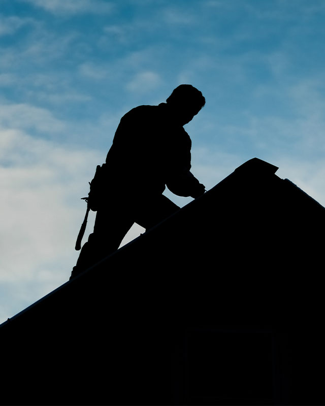 Worker from roof repair company in Kansas City