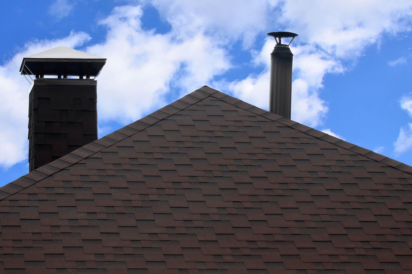 roof with shingles with blue sky